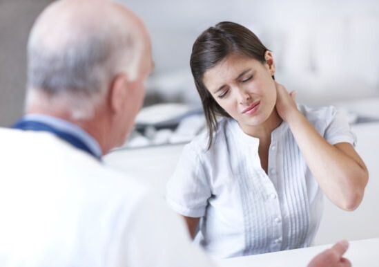 Doctor examining neck pain